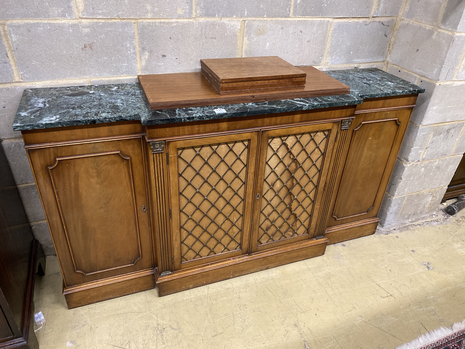 A George III style green marble topped breakfront mahogany side cabinet, width 168cm, depth 40cm, height 89cm